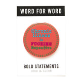 Large coral colored pinback button with an ring of green dollar signs around the edge of the button, reads CHRONIC ILLNESS IS in baby blue, FUCKING in hot pink, EXPEN$IVE in green. Button is on a backing postcard that reads WORD FOR WORD in a black & white band at the top, and BOLD STATEMENT Loud & Clear at the bottom.