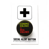 A round black 1.25" pinback button that reads Economic violence Is Real Violence. Badge is pinned to a Social Alert Button backing card.