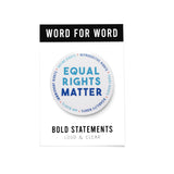 Big 3 inch round white pinback button with light blue & dark blue text that reads: TEQUAL RIGHTS MATTER. Smaller blue text runs in a circle around the permitter that says Reproductive Rights, Trans Rights, Disability Rights, Immigrant Rights, Voting Rights Button is on a Bold Statements Loud & Clear backing card.