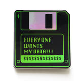 A black & green holographic sticker that look like a 1990's little hard floppy disc that reads EVERYONE WANTS MY DATA !!! with a strip of dollar signs where a label would be.