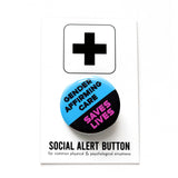 A round 1.25" pinback button with a blue and black split color design, reading "GENDER AFFIRMING CARE"in black text on the blue portion, and "SAVES LIVES" is in hot pink on the black background. The button is on a black and white Social Alert Button branded backing card.