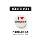 A round white pinback button that reads I LOVE STATIONERY, with love being indicated by a red heart. Button is on a branded Pinback Button Backing card.
