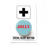 Round, pale blue-green pinback button that reads JOLLY in bright red text.  Button is on a Social Alert Button backing card.