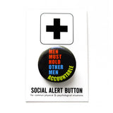 Round black pinback button that reads MEN MUST HOLD OTHER ACCOUNTABLE in neon yellow, orange and blue san serif text. The button is pinned to a Social Alert Button backing card.