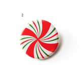 pinwheel spiral pinback button that looks like a peppermint candy. a number 2 in green indicates Design 02