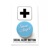 Light blue round pinback button that reads SNOW ANGLE in a white script font, at an angle.  Badge is on a Social Alert Button backing card.