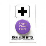 Round purple lavender pinback button that reads SUGAR PLUM FAIRY in rich cream text. Button is on a Social Alert Button backing card.