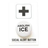 Round pinback button that reads ABOLISH ICE in black text on a white background. The button is pinned to a Social Alert Button backing card.