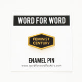 Hexagon shaped hard enamel lapel pin that says FEMINIST CENTURY on a backing card.