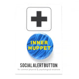 A round 1.25" pinback button with a blue synthetic puppet fur background, that reads INNER MUPPET in yellow text. Button is on a Social Alert Button backing card.