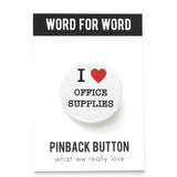 A round white pinback button that reads I LOVE OFFICE SUPPLIES, with love being indicated by a red heart. Button is on a branded Pinback Button Backing card.