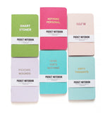 Six pockets Notebooks lined up in two rows of three. Each cover has a different phrase. SMART STONER, NOTHING PERSONAL, NSFW, PSYCHIC WOUNDS, HERE GOES NOTHING, DIRTY THOUGHTS.   