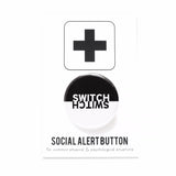 Round Pinback button that is black on the top half, and white on the bottom half.  The word SWITCH is in the inverse color on each side. Pinned to a Social Alert Button backing card.