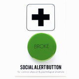 Round pinback button that says BROKE. Dark green text on a kelly green background. Button on a Social Alert Button backing card.